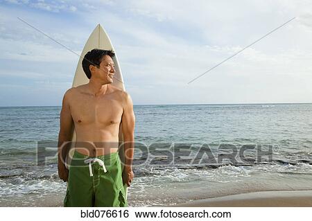 Japanese man with surfboard on beach View Large Photo Image Stock Photograph - Japanese man with surfboard on beach. Fotosearch