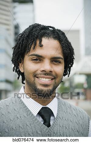 Mixed race businessman smiling View Large Photo Image Picture - Mixed race businessman smiling. Fotosearch