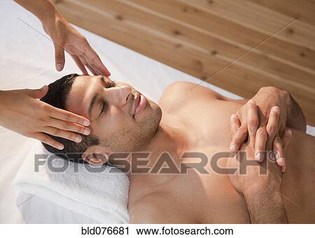 Mixed race man receiving head massage View Large Photo Image Stock Image - Mixed race man receiving head massage. Fotosearch