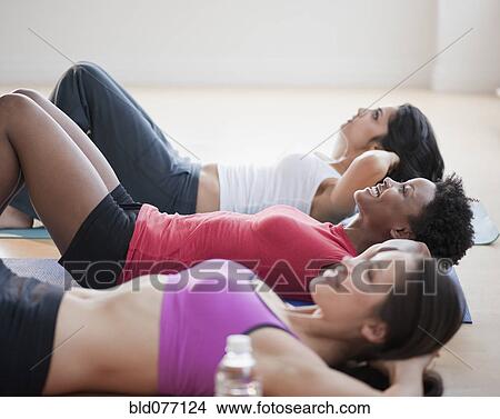 Friends exercising together View Large Photo Image Picture - Friends exercising together. Fotosearch