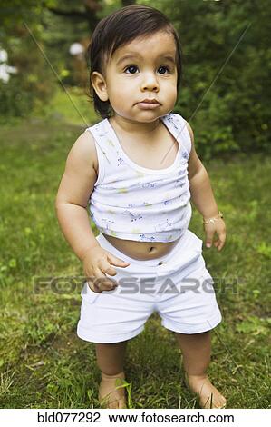 Hispanic baby boy walking in grass View Large Photo Image Stock Image - Hispanic baby boy walking in grass. Fotosearch