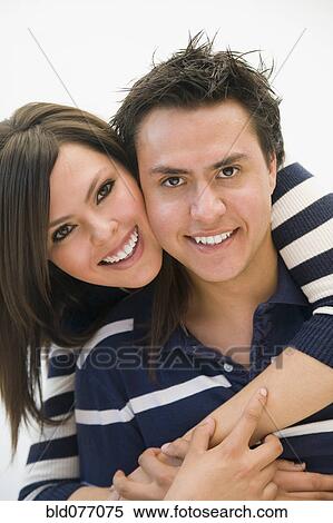 Hispanic couple hugging View Large Photo Image Stock Photography - Hispanic couple hugging. Fotosearch