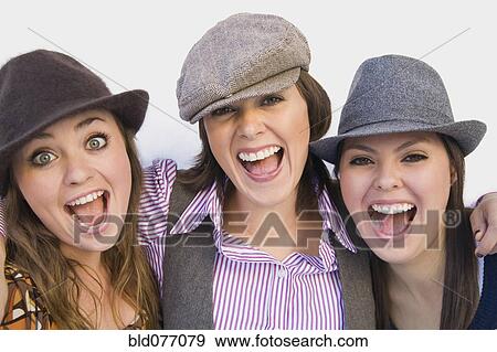 Stock Photo - Hispanic friends in old-fashioned hats laughing. Fotosearch