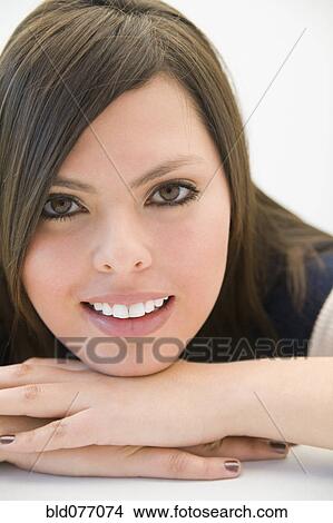 Hispanic woman with head in hands View Large Photo Image Picture - Hispanic woman with head in hands. Fotosearch