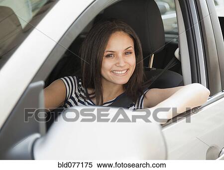 Mixed race woman driving car View Large Photo Image Stock Photography - Mixed race woman driving car. Fotosearch