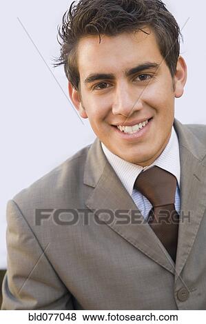 Smiling Hispanic businessman View Large Photo Image Stock Photo - Smiling Hispanic businessman. Fotosearch