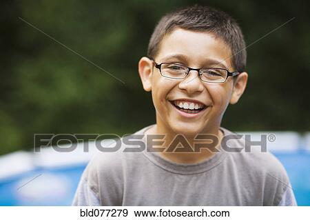 Stock Photo - Smiling mixed race boy in eyeglasses. Fotosearch