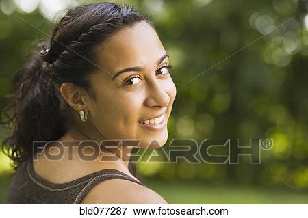 Stock Photo - Smiling mixed race woman. Fotosearch