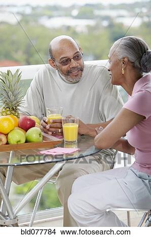 African couple drinking orange juice View Large Photo Image Picture - African couple drinking orange juice. Fotosearch