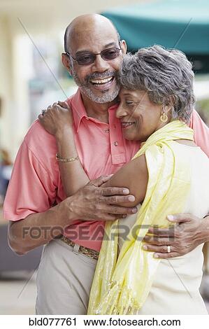 African couple hugging View Large Photo Image Stock Image - African couple hugging. Fotosearch