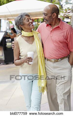 Stock Photo - African couple walking together. Fotosearch