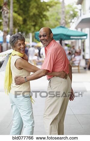 Stock Photograph - African couple walking together. Fotosearch