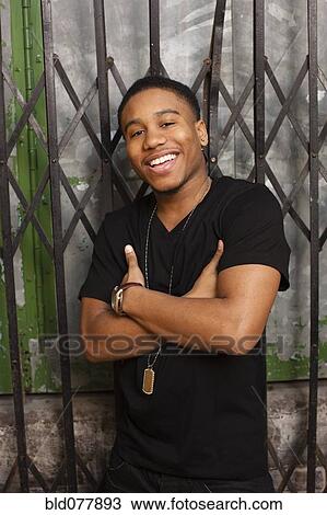 African man smiling with arms crossed View Large Photo Image Stock Image - African man smiling with arms crossed. Fotosearch