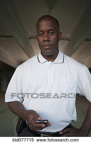 African man standing in parking garage View Large Photo Image Stock Photo - African man standing in parking garage. Fotosearch
