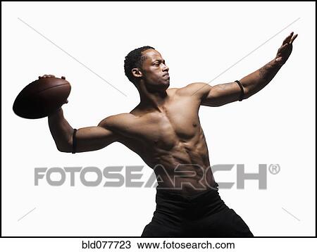Bare chested football player throwing football View Large Photo Image Stock Image - Bare chested football player throwing football. Fotosearch