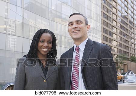 Business people standing on urban street View Large Photo Image Stock Photo - Business people standing on urban street. Fotosearch