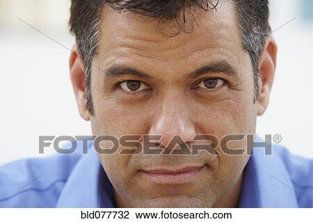 Stock Image - Close up of Hispanic businessman. Fotosearch
