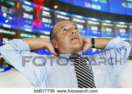 Hispanic businessman at stock exchange View Large Photo Image Stock Photo - Hispanic businessman at stock exchange. Fotosearch