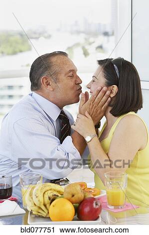 Stock Image - Hispanic couple kissing. Fotosearch