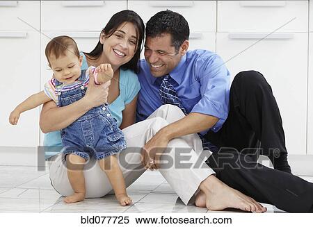 Hispanic family sitting on floor View Large Photo Image Stock Photography - Hispanic family sitting on floor. Fotosearch