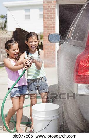 Hispanic girls washing car View Large Photo Image Stock Photography - Hispanic girls washing car. Fotosearch