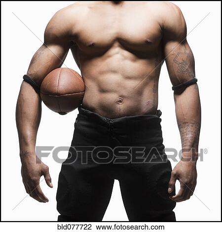 Midsection of bare chested football player View Large Photo Image Stock Image - Midsection of bare chested football player. Fotosearch