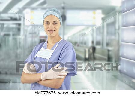 Mixed race doctor wearing scrubs in hospital View Large Photo Image Stock Photography - Mixed race doctor wearing scrubs in hospital. Fotosearch