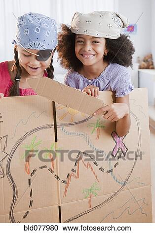 Stock Image - Girls dressing up as pirates. Fotosearch