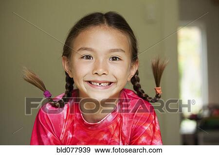 Grinning mixed race girl View Large Photo Image Stock Photo - Grinning mixed race girl. Fotosearch