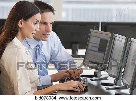 Hispanic business people working on computer View Large Photo Image Picture - Hispanic business people working on computer. Fotosearch