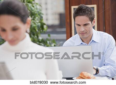 Hispanic businessman working in cafe View Large Photo Image Stock Image - Hispanic businessman working in cafe. Fotosearch
