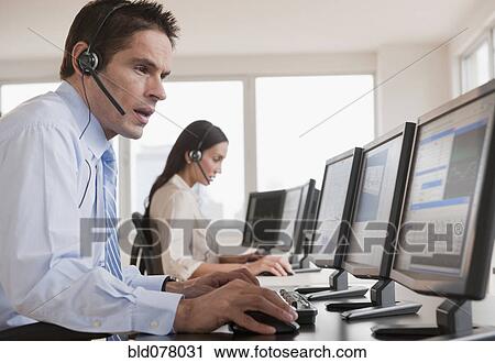 Hispanic businessman working on computer View Large Photo Image Stock Image - Hispanic businessman working on computer. Fotosearch