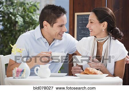 Hispanic couple having breakfast in cafe View Large Photo Image Stock Photo - Hispanic couple having breakfast in cafe. Fotosearch