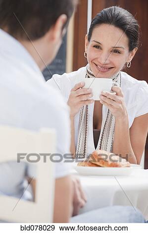 Hispanic couple having breakfast in cafe View Large Photo Image Stock Photo - Hispanic couple having breakfast in cafe. Fotosearch