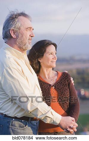 Picture - Hispanic couple holding hands. Fotosearch