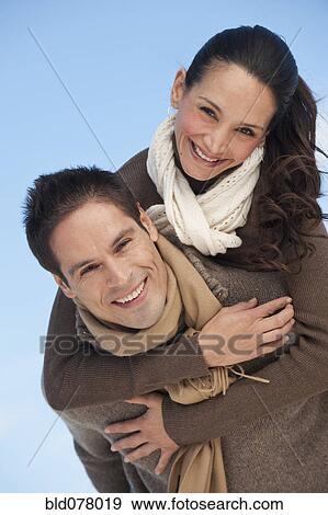 Stock Photo - Hispanic couple hugging. Fotosearch