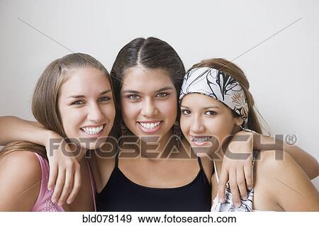 Hispanic friends hugging View Large Photo Image Stock Photo - Hispanic friends hugging. Fotosearch