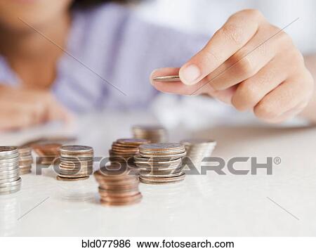 Hispanic girl stacking coins View Large Photo Image Stock Photograph - Hispanic girl stacking coins. Fotosearch
