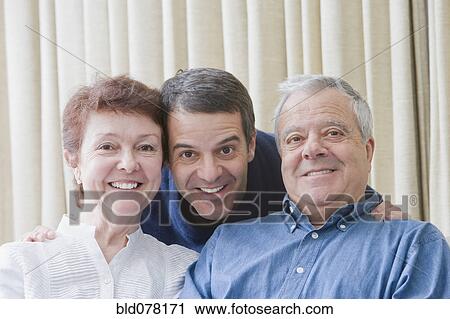Hispanic parents and adult son smiling View Large Photo Image Stock Image - Hispanic parents and adult son smiling. Fotosearch