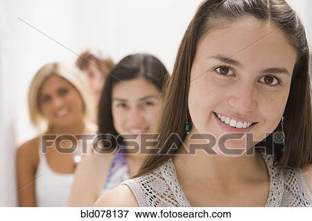 Hispanic woman and friends smiling View Large Photo Image Stock Photo - Hispanic woman and friends smiling. Fotosearch