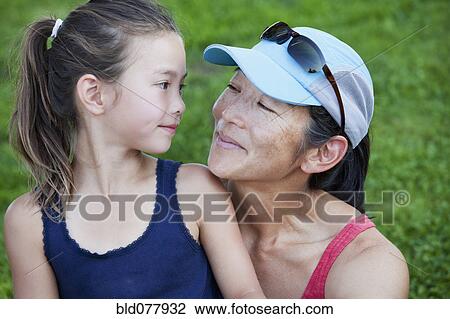 Japanese mother and daughter smiling View Large Photo Image Stock Image - Japanese mother and daughter smiling. Fotosearch