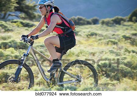 Japanese woman riding bicycle View Large Photo Image Picture - Japanese woman riding bicycle. Fotosearch