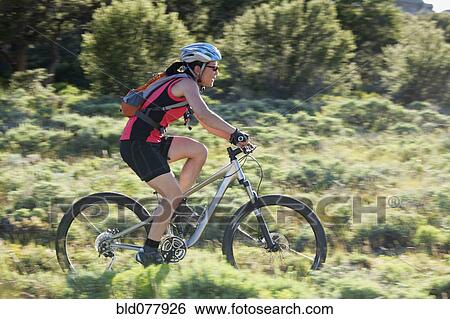 Japanese woman riding bicycle View Large Photo Image Stock Photograph - Japanese woman riding bicycle. Fotosearch