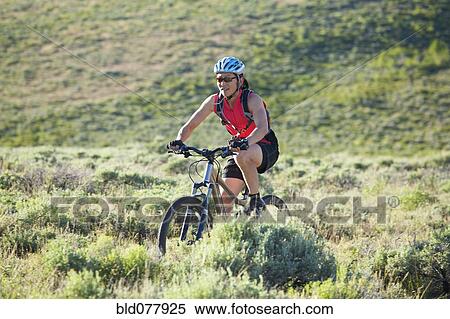 Japanese woman riding bicycle View Large Photo Image Stock Photography - Japanese woman riding bicycle. Fotosearch