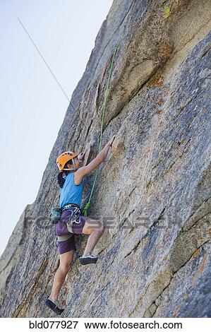 Japanese woman rock climbing View Large Photo Image Stock Photo - Japanese woman rock climbing. Fotosearch