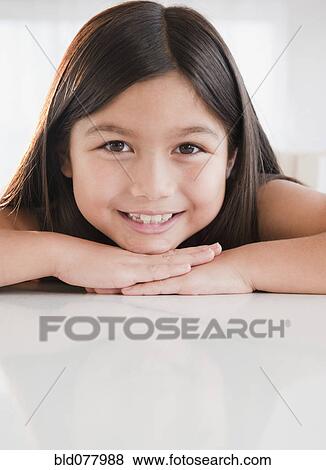Stock Photo - Mixed race girl smiling. Fotosearch