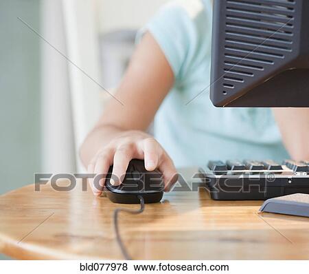 Stock Photo - Mixed race girl using computer. Fotosearch