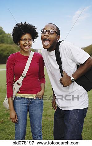 Playful couple in park View Large Photo Image Stock Photo - Playful couple in park. Fotosearch