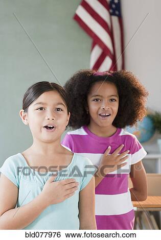 School girls pledging allegiance to the flag View Large Photo Image Stock Photograph - School girls pledging allegiance to the flag. Fotosearch