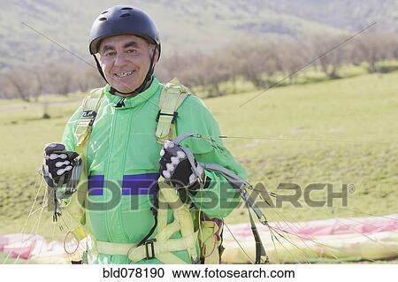 Senior Hispanic man skydiving View Large Photo Image Stock Image - Senior Hispanic man skydiving. Fotosearch